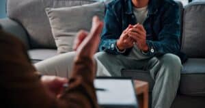Man discussing long-term TRT treatment plan with his provider during a follow-up consultation